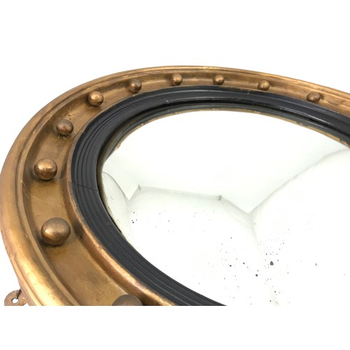 76 - ROUND CONVEX MIRROR WITH GILT BALL DECORATION