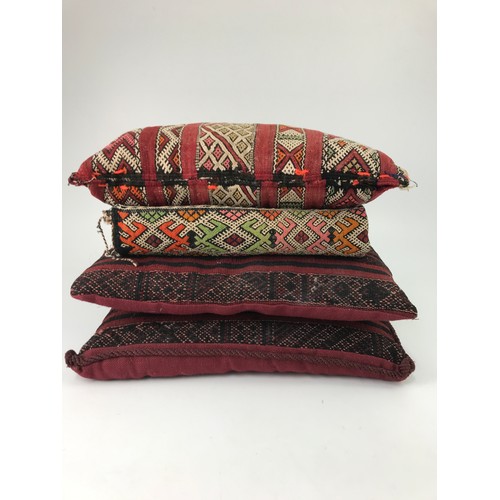 440 - 4 RED GROUND CUSHION COVERS AND A BED THROW, APPROX 280 x 208 CM