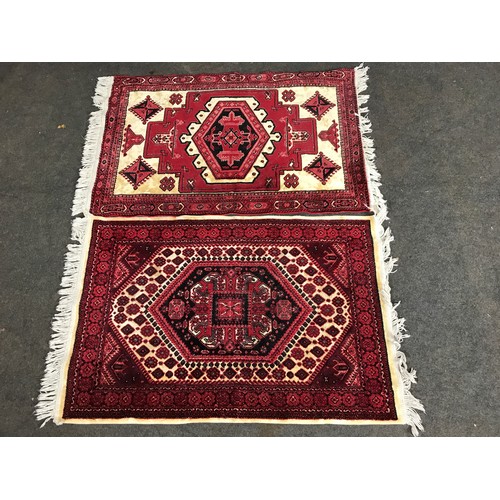 417 - 2 RED GROUND SILK RUGS, APPROX 107CM LONG