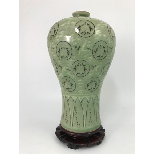 265 - GREEN GLAZED VASE 32cm ALL WITH HARD WOOD STAND 37cm TALL