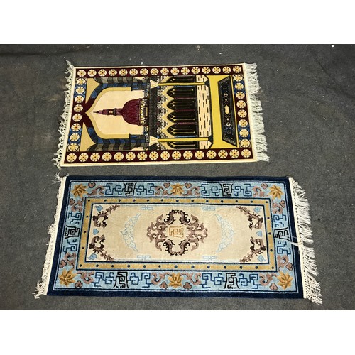 425 - TWO COLOURFUL GROUND RUGS, LARGEST IS 127CM LONG