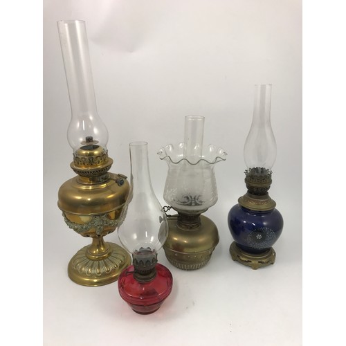 306 - 4 VARIOUS OIL LAMPS