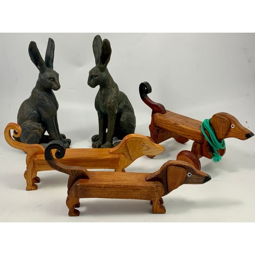 535 - 2 FIGURES DEPICTING HARES TOGETHER WITH STYLISED WOODEN DOG FIGURES