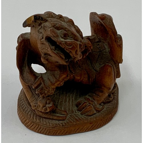 514 - CARVED SANDALWOOD NETSUKE AND A CARVED STONE, POSSIBLY ROMAN, FIGURE, BOTH AF