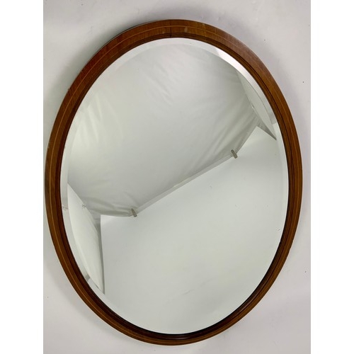 60 - LARGE OVAL INLAID MAHOGANY FRAMED BEVELLED MIRROR, APPROX. 84 X 60 cm