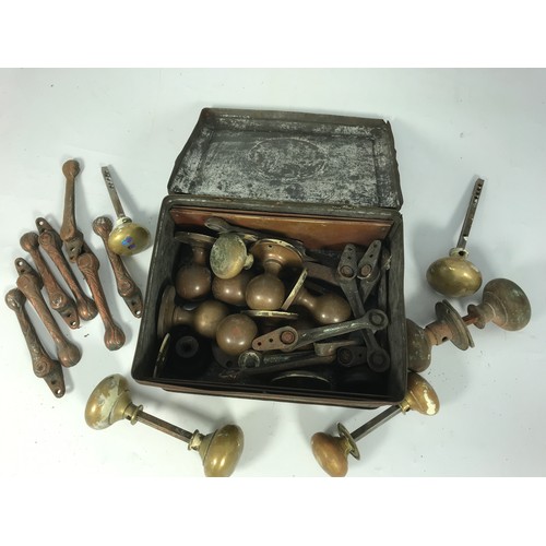 324 - BOX OF BRASS DOOR KNOBS, STAIR CARPET CLIPS ETC.