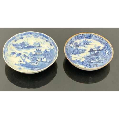 245 - 2 ORIENTAL PORCELAIN BLUE AND WHITE SAUCER DISHES, LARGEST AF AND APPROX. 14 cm dia.