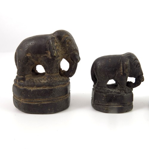 255 - A GRADUATED SET OF POSSIBLY TIBETAN BRONZE OPIUM WEIGHTS MODELLED AS ELEPHANTS