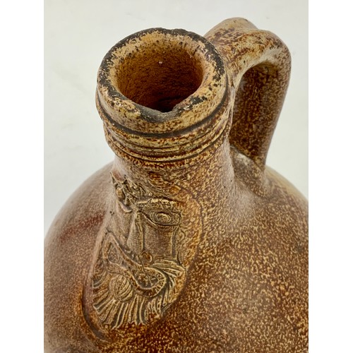 83 - BELLARMINE JUG, A SMALL 17TH CENTURY GERMAN SALT GLAZED FLAGON FEATURING A BEARDED MASK ABOVE A SEAL... 