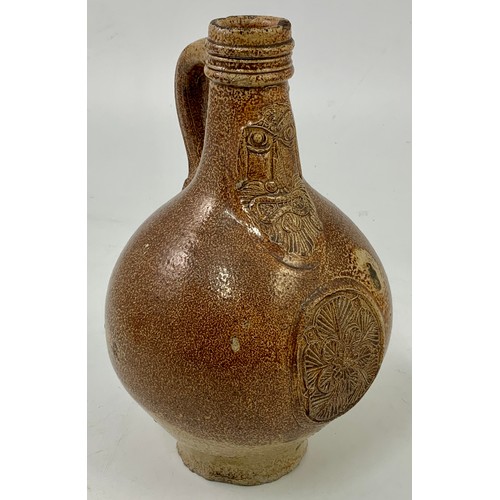 83 - BELLARMINE JUG, A SMALL 17TH CENTURY GERMAN SALT GLAZED FLAGON FEATURING A BEARDED MASK ABOVE A SEAL... 