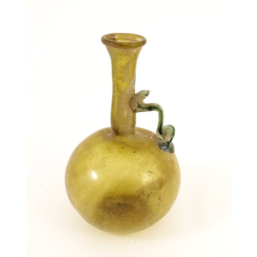 124 - ROMAN OLIVE GREEN GLASS FLASK, 3RD-4TH CENTURY AD, WITH GLOBULAR BODY AND EVERTED RIM, BLUE GLASS HA... 