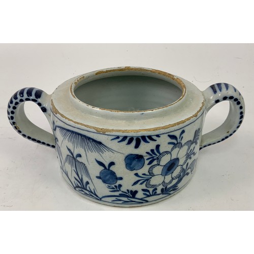 91 - DELFT WARE 2 HANDLED BLUE AND WHITE POT WITH FLOWER DECORATION, APPROX. 15 cm dia.