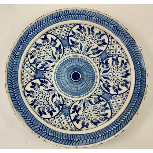 94 - TIN GLAZED BLUE AND WHITE CHARGER/ SHALLOW BOWL WITH GEOMETRIC AND FLORAL DECORATION, APPROX. 36 cm ... 