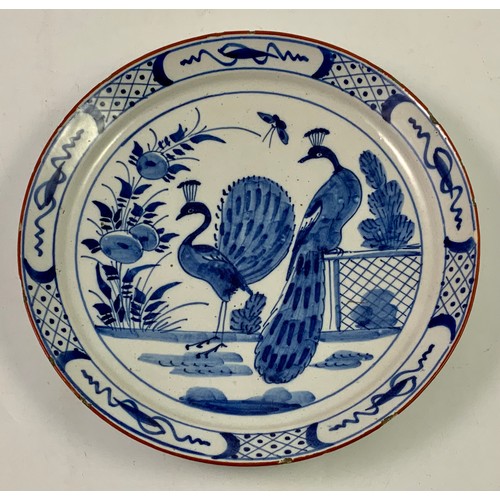 93 - SHALLOW DELFT WARE DISH WITH BLUE AND WHITE EXOTIC BIRD DECORATION, APPROX. 22 cm dia.