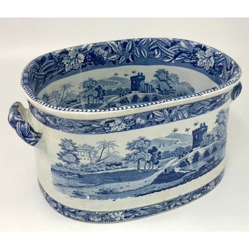 73 - STAFFORDSHIRE, POSSIBLY SPODE, BLUE AND WHITE TRANSFER DECORATED DEPICTING A CASTLE AND BRIDGE SCENE... 