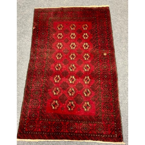 674 - RED GROUND RUG, APPROX. 190 X 112 cm