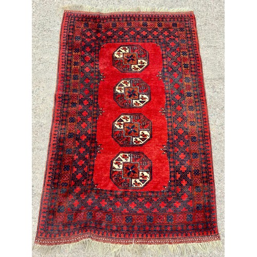 681 - RED GROUND RUG approx. 213 x 135 cm