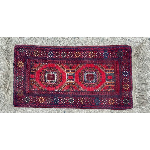 677 - RED GROUND PRAYER MAT, APPROX. 103 X 51 cm