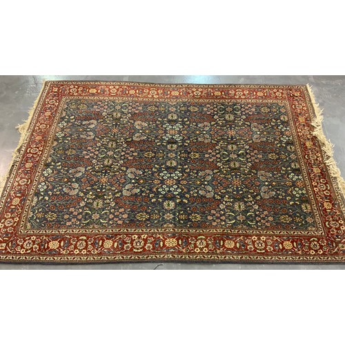 672 - RED AND BLUE GROUND TURKISH RUG, APPROX. 280 X 174 cm