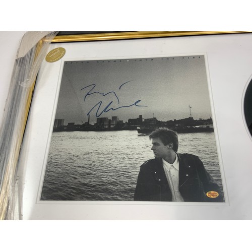 308 - FRAMED PICTURE WITH MOUNTED RECORD BRYAN ADAMS, INTO THE CITY, PHOTOGRAPH HAS SIGNATURE, CERTIFICATE... 