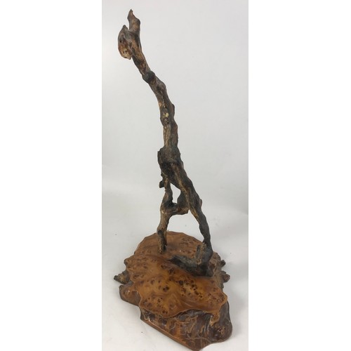 296 - WOODEN ABSTRACT SCULPTURE ON BURR WOOD PLINTH 53cm TALL