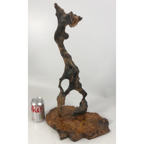 296 - WOODEN ABSTRACT SCULPTURE ON BURR WOOD PLINTH 53cm TALL