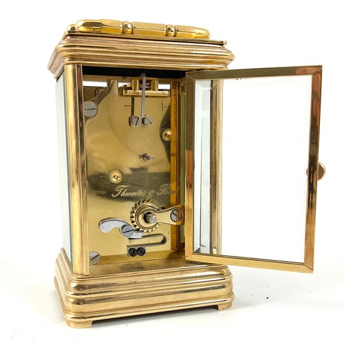 308 - A THWAITES & REED BRASS CASED CARRIAGE CLOCK, BEVELLED GLASS APETURES, BRASS SWING HANDLE, ENAMEL DI... 