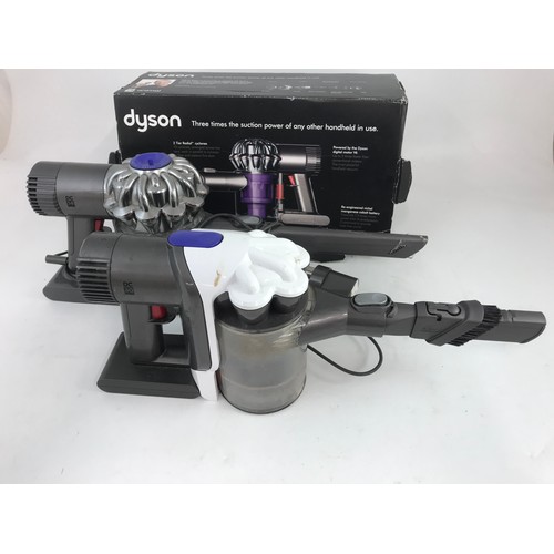 446 - TWO HAND HELD DYSON VACUUM CLEANERS