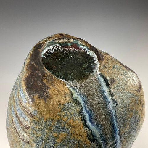 225 - A STUDIO POTTERY SCULPTURE IN THE FORM OF A LARGE BOULDER WITH GLAZED POOL AND WATERFALL, 30CM HIGH