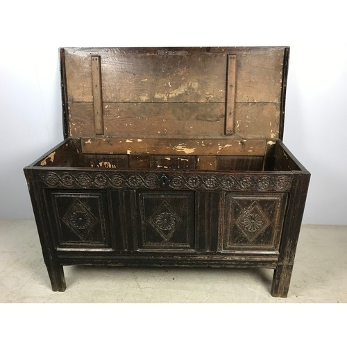 669 - CARVED OAK BLANKET CHEST ON STILE FEET, APPROX. 136 cm