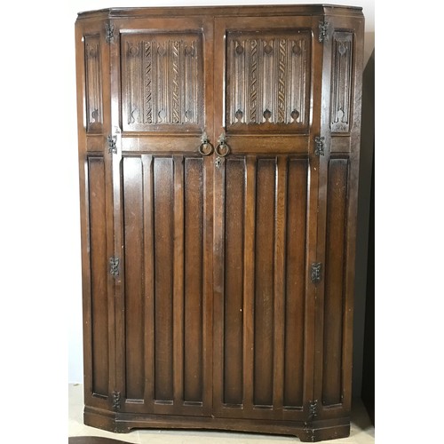 541 - TWO 20TH CENTURY DARK OAK WARDROBES WITH LINEN FOLD DECORATION – DOUBLE AND SINGLE