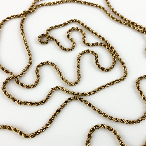 600 - GOLD COLOURED MUFF CHAIN, APPROX. 140 cm,  36.5g, INDISTINCTLY MARKED, POSSIBLY M&M 15 (NO ESTIMATE)