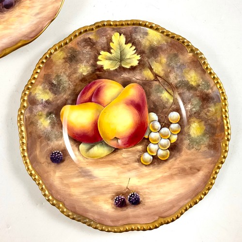 106 - TWO ROYAL WORCESTER STYLE FRUIT PAINTED PLATES BY G DELANEY, EACH DECORATED WITH VARIOUS FRUITS AND ... 