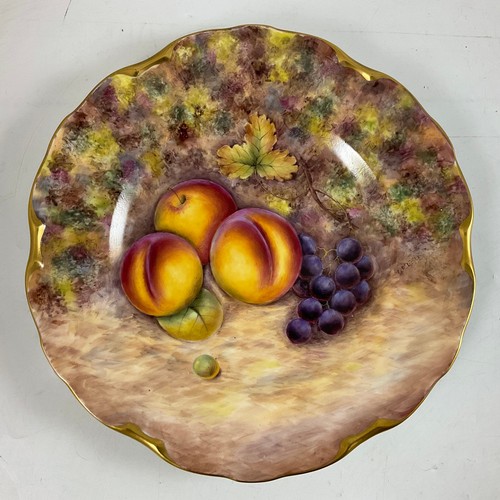 106 - TWO ROYAL WORCESTER STYLE FRUIT PAINTED PLATES BY G DELANEY, EACH DECORATED WITH VARIOUS FRUITS AND ... 