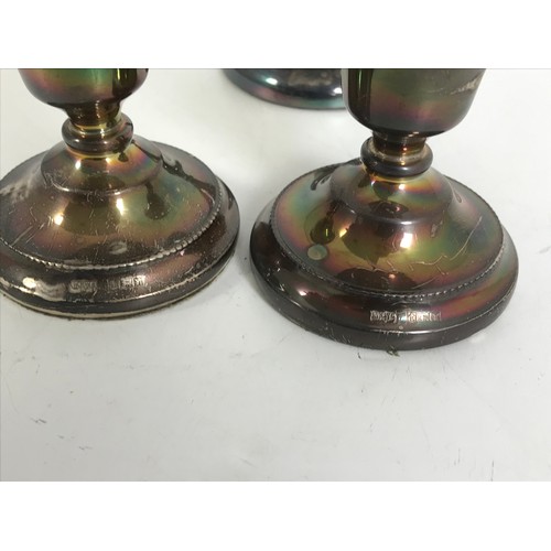 384 - SILVER TRUMPET VASE TOGETHER WITH PAIR OF LOADED SILVER DWARF CANDLESTICKS