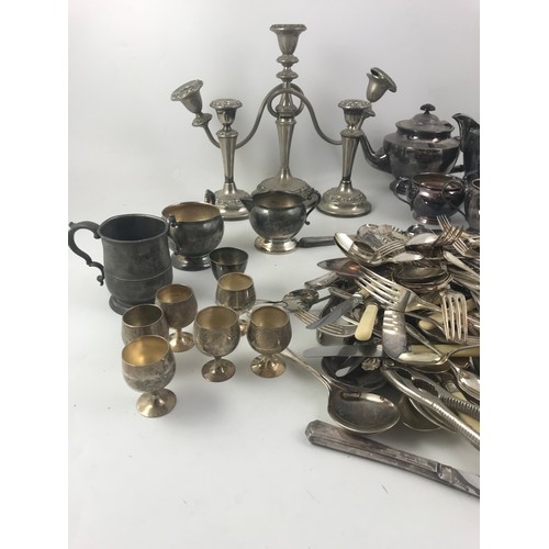 321 - A LARGE COLLECTION OF SILVER PLATED WARE INC. WALKER & HALL TEA SET, CANDLESTICKES CUTLERY  ETC.