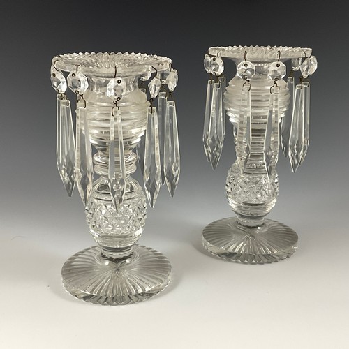 141 - A PAIR OF REGENCY ANGLO IRISH CUT GLASS LUSTRES, FAN CUT EDGE, RING AND KNOPPED BALUSTER STEM ON CIR... 