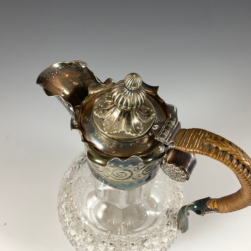 142 - A GOOD QUALITY CUT GLASS CLARET JUG WITH SILVER PLATED COLLAR AND SPOUT, ENGRAVED Rd NO. 29677, WITH... 