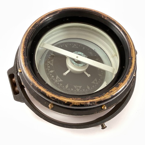 287 - A KELVIN & HUGHES BRASS CASED PROJECTOR COMPASS, GLASS FACED, THE PAINTED BRASS GIMBAL RING WITH FIX... 