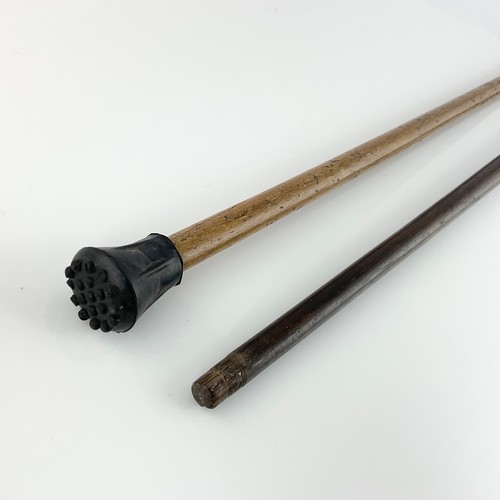 257 - A SILVER CAPPED AND COLLARED WALKING STICK, TOGETHER WITH A ROSEWOOD STICK WITH CAST METAL MASK FINI... 