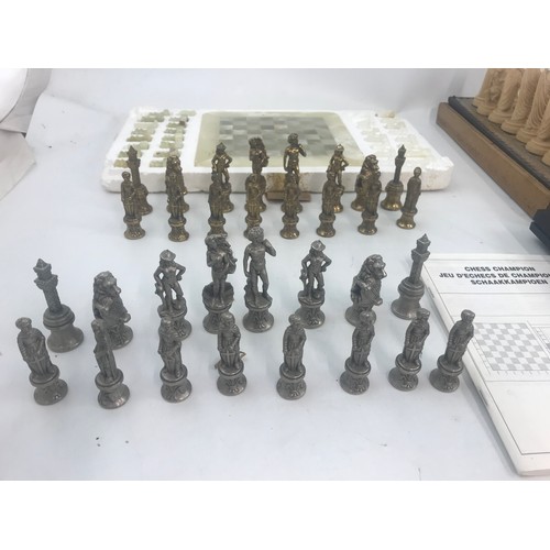 56 - METAL, MARBLE & RESIN CHESS SETS WITH A CHESS CHAMPION 2150 L GO