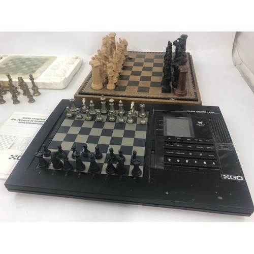 56 - METAL, MARBLE & RESIN CHESS SETS WITH A CHESS CHAMPION 2150 L GO