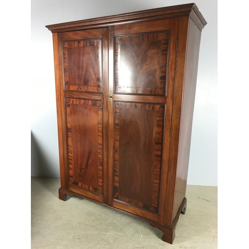 512 - AN EDWARDIAN FLAME MAHOGANY AND CROSSBANDED DOUBLE WARDROBE, WITH BOXWOOD STRUNG DOORS, RAISED ON BR... 