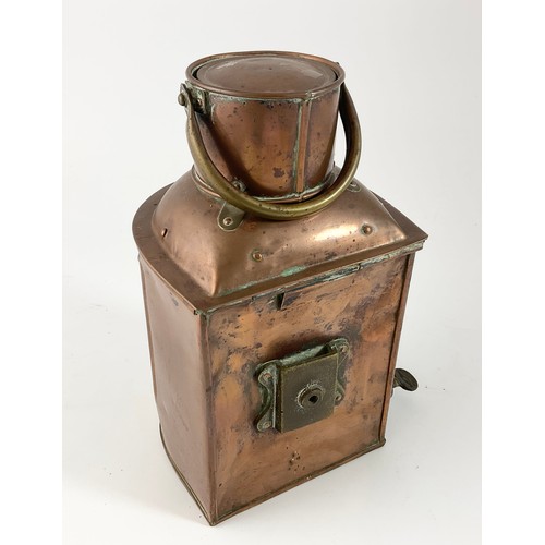 222 - A COPPER AND BRASS MOUNTED STERN LIGHT WITH BRASS SWING HANDLE, 27CM HIGH, TOGETHER WITH A BRASS CAS... 