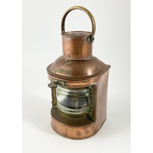 222 - A COPPER AND BRASS MOUNTED STERN LIGHT WITH BRASS SWING HANDLE, 27CM HIGH, TOGETHER WITH A BRASS CAS... 