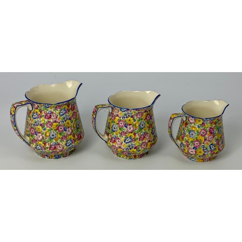 130 - SET OF 3 GRADUATED CHINTZ JUGS TOGETHER WITH JASPER WARE ETC.