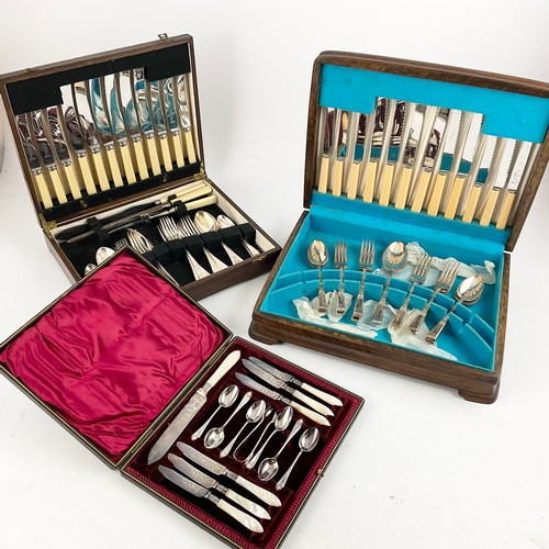 382 - TWO OAK CASED PART CUTLERY SETS AND A CASED SET OF MOTHER OF PEARL CAKE KNIFE AND KNIFE SET WITH TEA... 