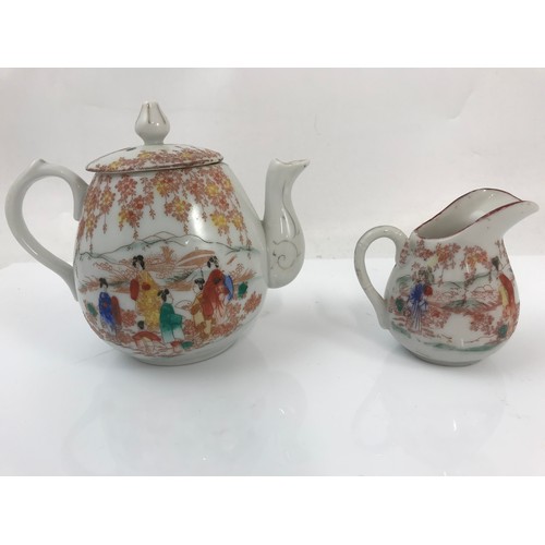 154 - ORIENTAL TEA POT AND CREAM JUG