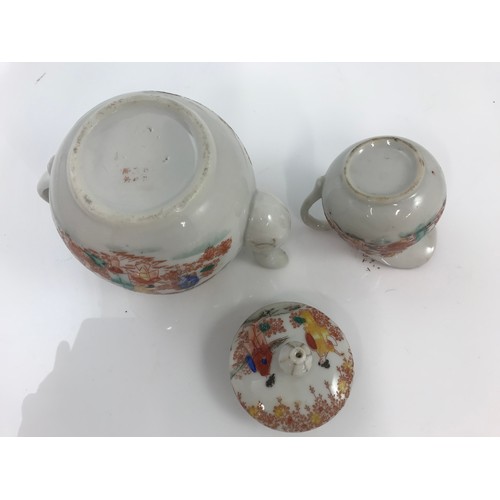 154 - ORIENTAL TEA POT AND CREAM JUG