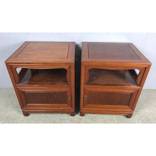 575 - PAIR OF ORIENTAL HARDWOOD BEDSIDE CUPBOARDS